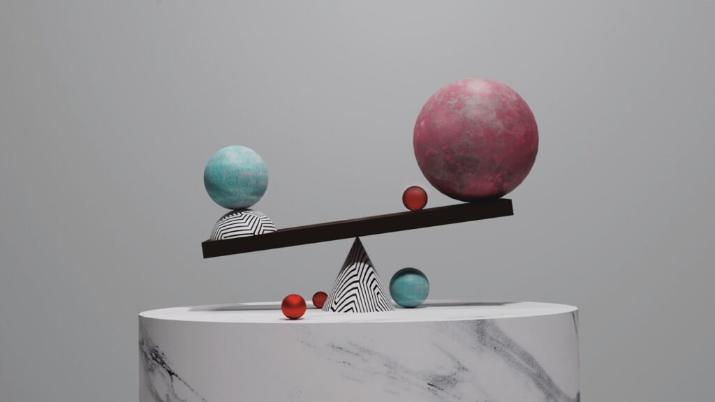 A balance scale with spheres on a marble pedestal against a grey background